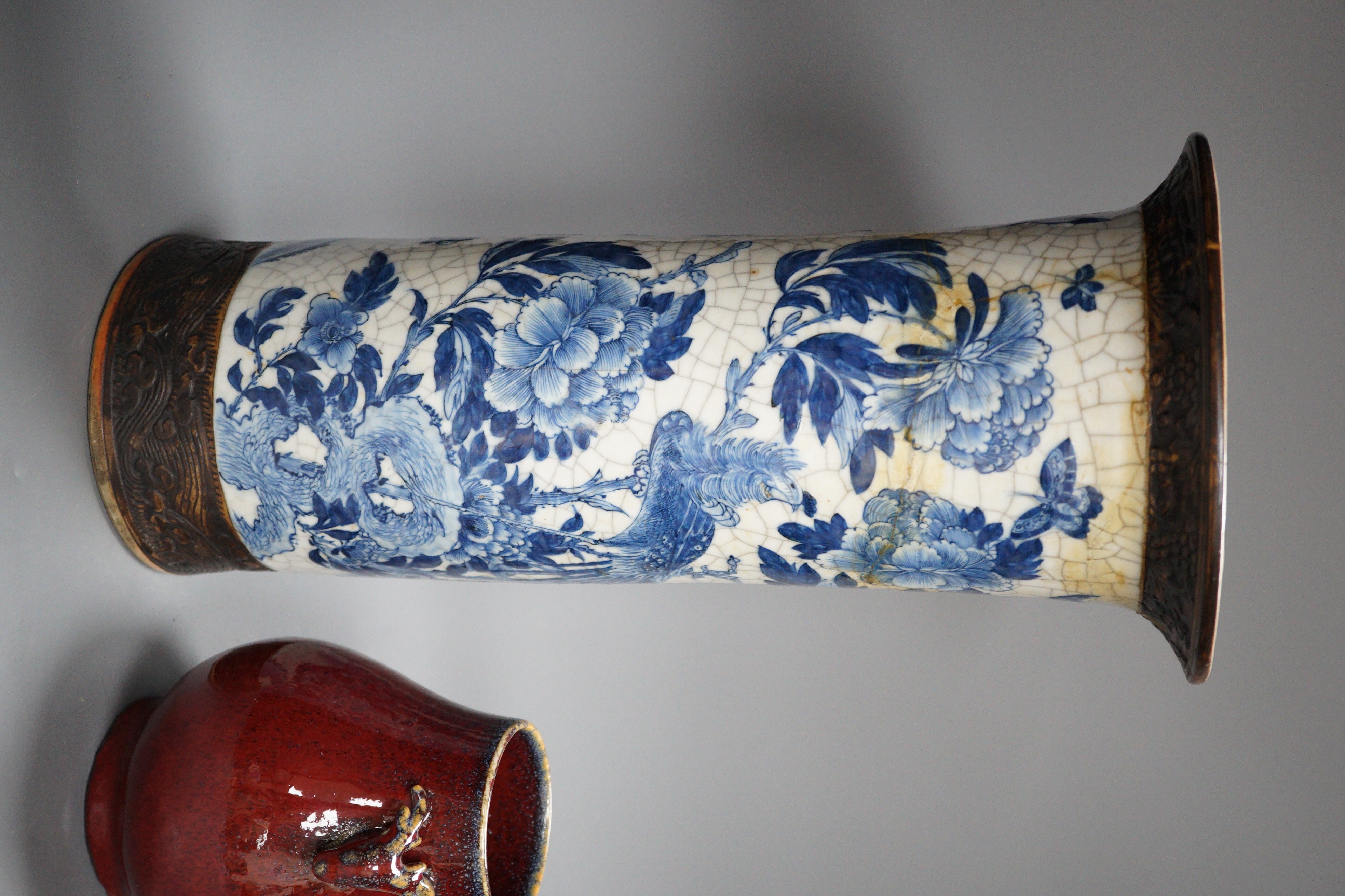 A large Chinese blue and white crackle glaze vase, a sang de boeuf vase and a monochrome jar, tallest 40cm